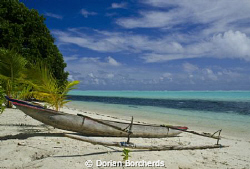 A Canoe on the beach in the New Ireland Province by Dorian Borcherds 